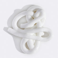 Swirl of Flamingo Daily Moisturizing Lotion squeezed out of the tube to show the lush texture